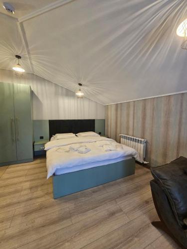 a bedroom with a large bed in a room at Creative hotel in Gyumri