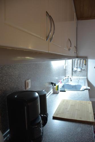 a kitchen with a coffee maker on a counter at Lazatka in Samothraki