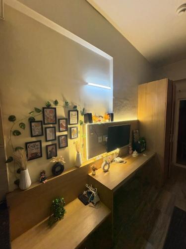a desk with a computer in a room at Nest And Rest Stay in Greater Noida