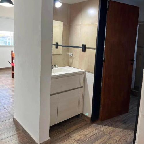 a bathroom with a sink and a mirror at Lusanyun3 in Villa Parque Siquiman