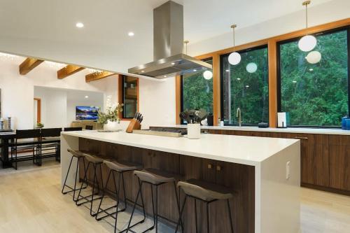 a kitchen with a large island with bar stools at Aspire at Mount Baker in Glacier