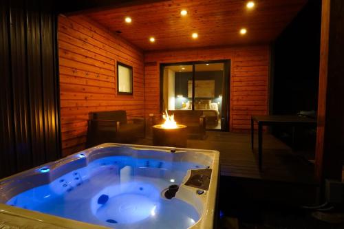 a jacuzzi tub in a room with a living room at Aspire at Mount Baker in Glacier