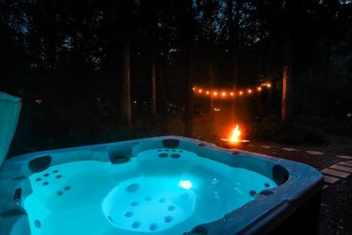 a hot tub at night with a lit candle at Timberline Terrace in Glacier