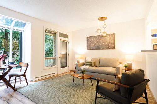 a living room with a couch and a table at Twin Lakes Retreat in Glacier