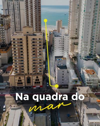 a city with a yellow arrow on a city at Hotel Melo in Balneário Camboriú