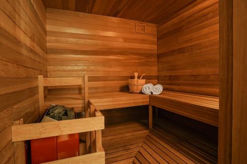a wooden sauna with a pair of towels in it at Skywood in Deming