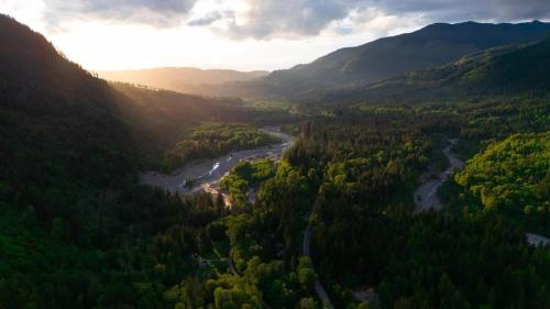 an aerial view of a river in a valley with mountains at Evergreen Lodge in Deming