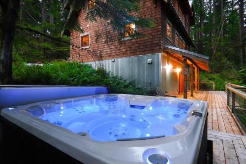 a jacuzzi tub in front of a house at The Shuksan in Deming