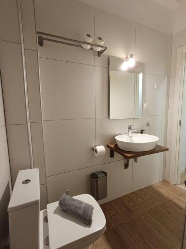 a bathroom with a white toilet and a sink at DOWNTOWN 4 in Alexandroupoli