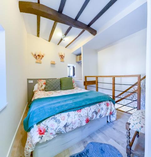 a bedroom with a bed in a room at Apartamentos San Roque in Arenas de Cabrales