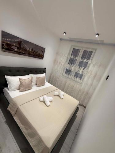 a bedroom with a bed with two towels on it at B&B Legnago in Legnago