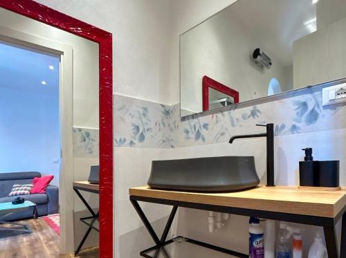 a bathroom with a sink and a mirror at Ramoscello in Altare