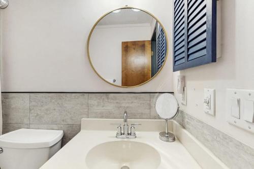 a bathroom with a white toilet and a mirror at Pinnacle 2101 in Beech Mountain