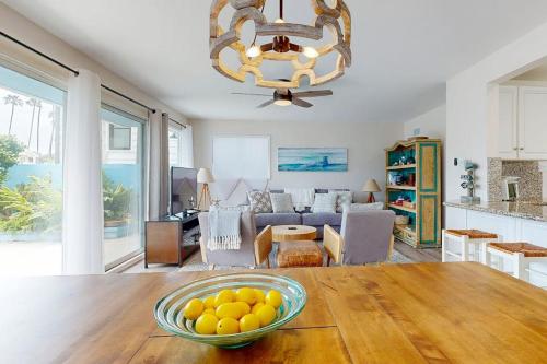 a bowl of oranges on a table in a living room at Balboa Blue Lagoon in Newport Beach