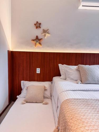 two beds sitting next to each other in a bedroom at NAAY - Nature 106 in Pôrto de Pedras
