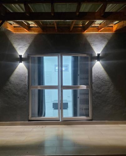 a window in a room with a view of a building at 32 on Magasa in Blantyre
