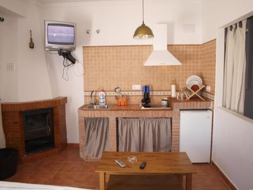 Η κουζίνα ή μικρή κουζίνα στο Apartahotel 4 vientos