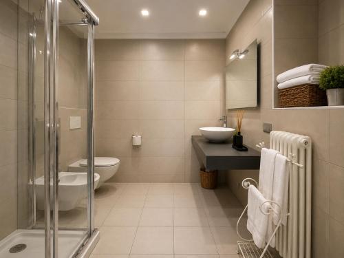 a bathroom with a toilet and a sink and a shower at Casa Vacanza Baragiola4 - Hotel San Giuseppe Group in Cernobbio