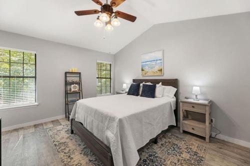 a bedroom with a bed and a ceiling fan at A Peaceful stay at The Pine Grove Retreat in Ladson