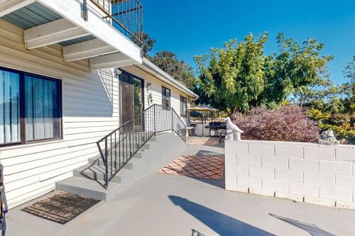 a house with a staircase leading to the front door at See Star Ranch in Nipomo