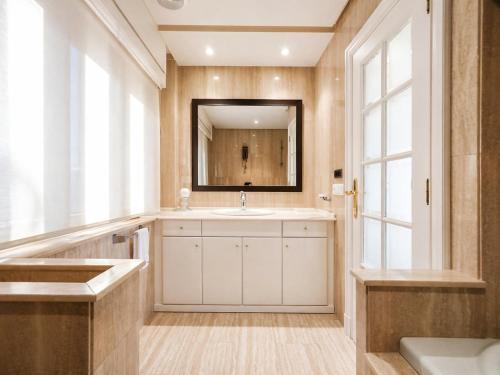 a bathroom with a sink and a mirror at Ocean Breeze in Oya