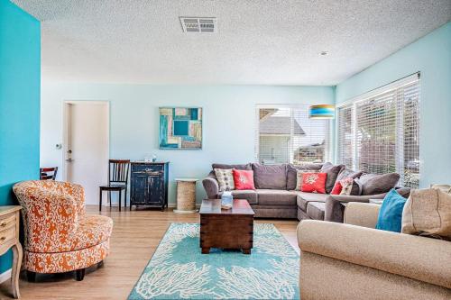 a living room with a couch and a chair at Morro Beach Bungalow in Morro Bay
