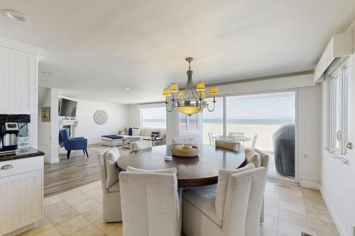 a kitchen and dining room with a table and chairs at Savor the View in Oxnard