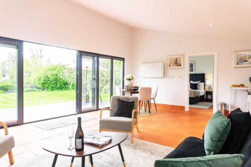 a living room with a couch and a table at Quarry View Studio in Shrewsbury with Parking in Shrewsbury