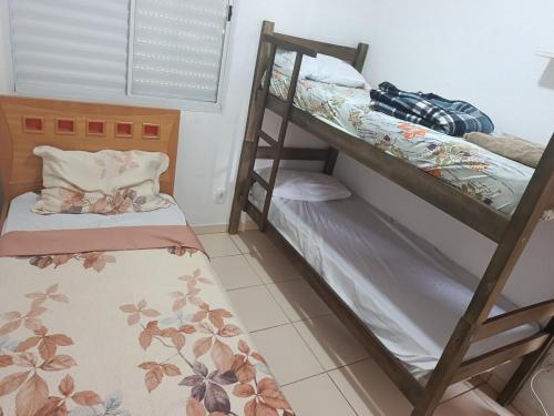 a bunk bed room with two bunk beds in it at Pedacinho do céu 2 in Dourados