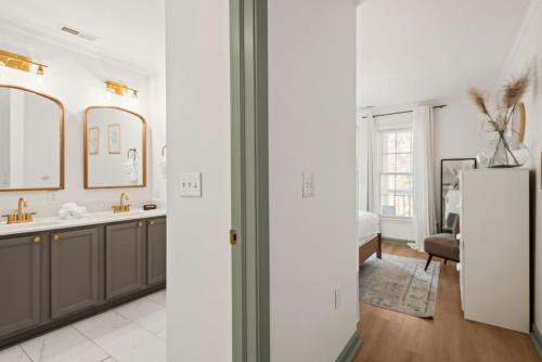 a kitchen with a sink and a refrigerator at Charleston 3BR Home · 3 Baths · Porches · Dogs OK in Charleston
