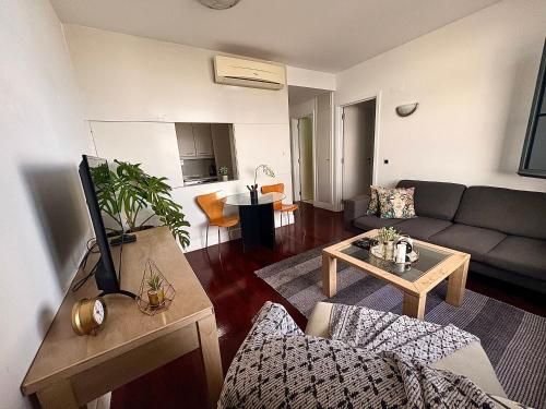 a living room with a couch and a table at Polana View Apartment I in Maputo