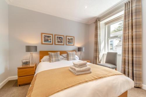 a bedroom with a bed with two towels on it at 4 Bed in Portpatrick oc-p43755 in Portpatrick