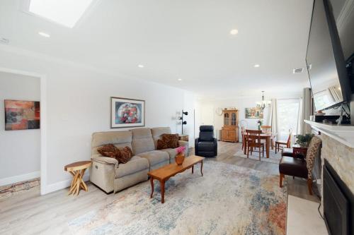 a living room with a couch and a table at Portola Oasis - Permit DRO-STR-18 in Monterey