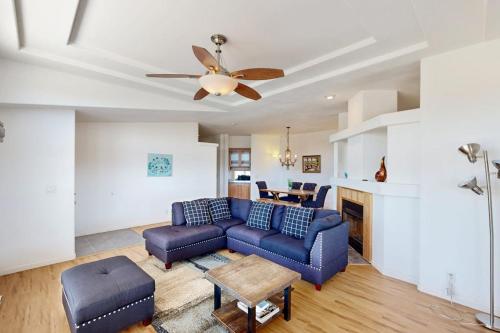 a living room with a couch and a ceiling fan at Nonpariel Escape in Paso Robles