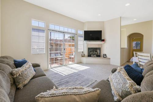 a living room with a couch and a fireplace at Santo Tomas Getaway in Grover Beach
