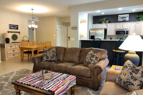 a living room with a couch and a table at Vistoso Resort Casita #163 in Oro Valley