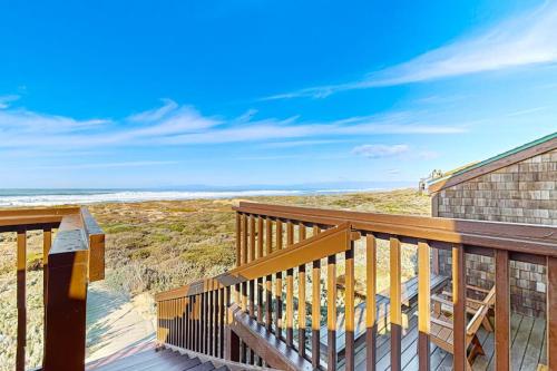 a wooden deck with a view of the ocean at Monterey Dune Dream in Moss Landing