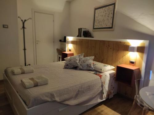 a bedroom with a bed with two towels on it at La casa di Simona in Pistoia
