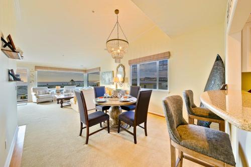 a dining room and living room with a table and chairs at San Clemente Ocean Luxury Bluff Top in San Clemente