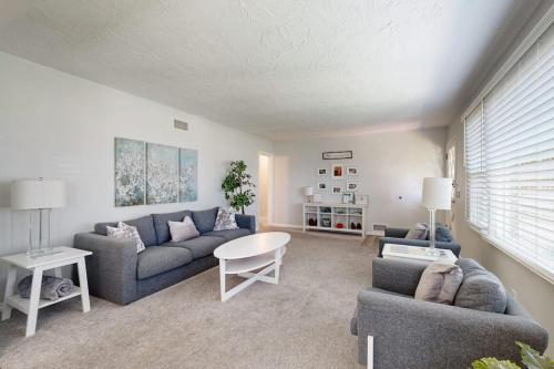 a living room with a couch and a table at Evening Oasis in Orange