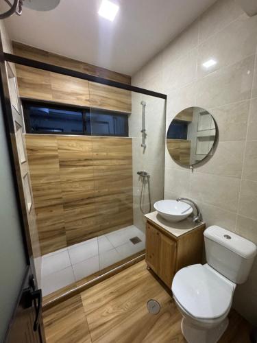 a bathroom with a toilet and a sink and a shower at Casa da Tá in Espargos