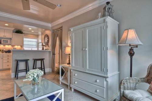 a living room with a large cabinet and a table at San Clemente - Monterey B in San Clemente