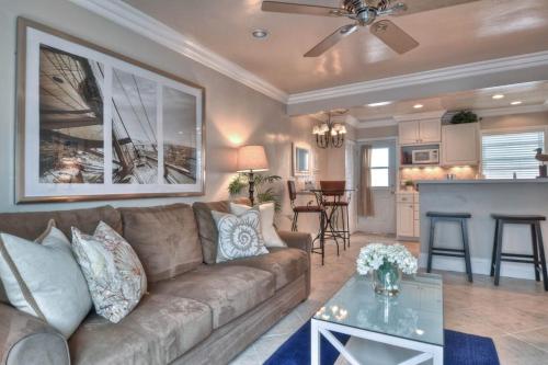 a living room with a couch and a kitchen at San Clemente - Monterey B in San Clemente