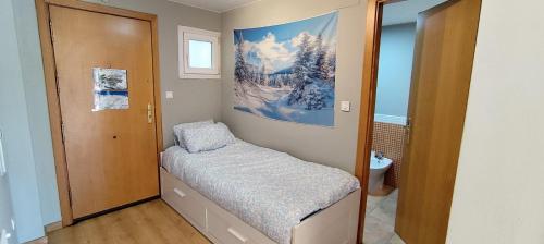 a small room with a small bed in it at Snow Dreams in Sierra Nevada