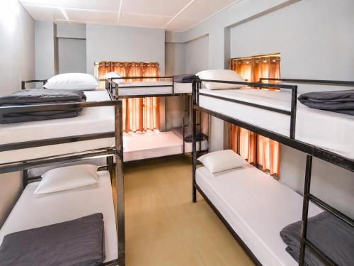 a room filled with lots of bunk beds at Hi Hostels Shillong in Shillong