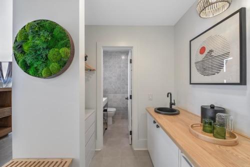 a kitchen with a counter and a sink in a room at Laguna Surf Lodge by SCP Hotels in Laguna Beach
