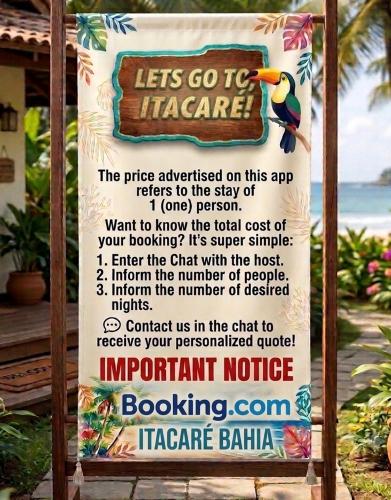 a sign for a hotel on the beach at Casa Fácil in Itacaré