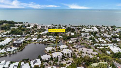 an aerial view of a resort with a yellow sign at Bluewater Haven - Sweeping Lagoon Views with Pool in Trinity Beach