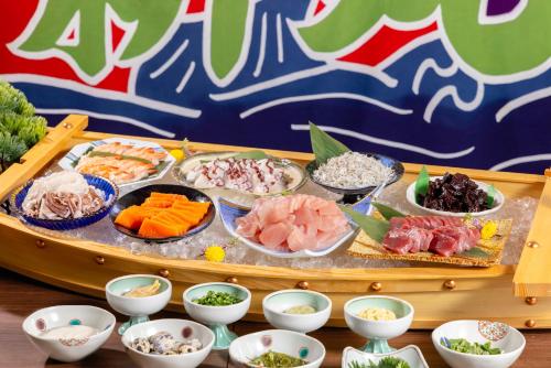 a tray full of different types of food on a table at Hotel Mariners Court Tokyo in Tokyo