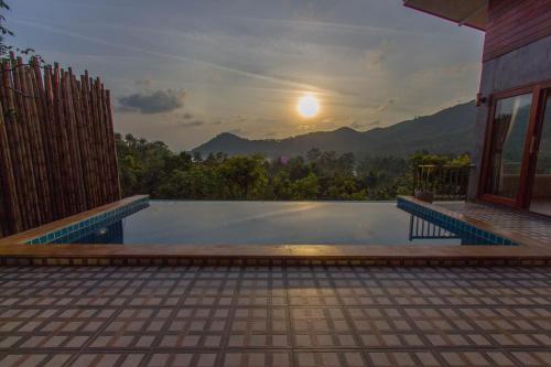 a swimming pool with a view of the mountains at Baan View Talay Pool Villas in Thong Nai Pan Yai